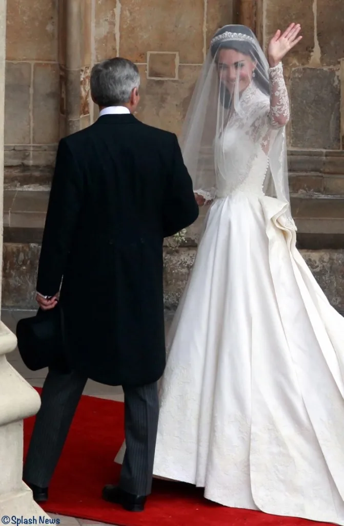 Kate Middleton Entering Westminster Abbey Waves to Crowds Sarah Burton Wedding Gown
