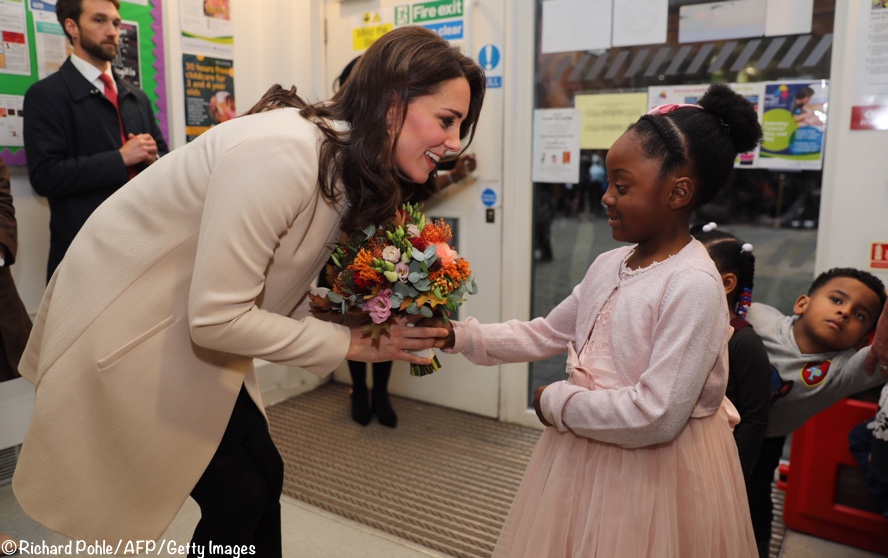 Kate-Getting-bouquet-flowers-from-Nevaeh-Hornsey-ROad-Family-Action-Nov-14-2017-Goat-Redgrave-Coat-RICHARD-POHLE-AFP-Getty-Images-888-x-560.jpg